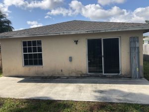 Backyard deck before pressure Cleaning services in Coconut Creek